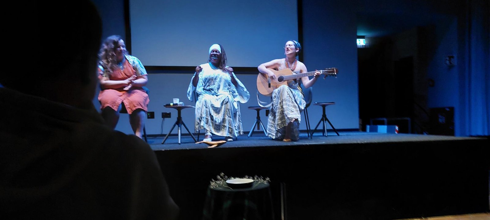 Three people on stage